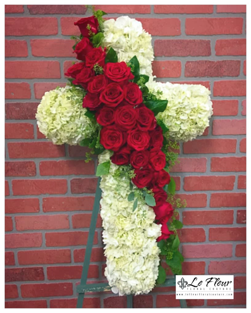 Sympathy Cross Arrangement of hydrangea and red roses made in a serpentine