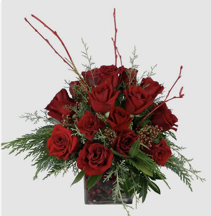 Our joyful bouquet puts the colors of Christmas on display. Red and