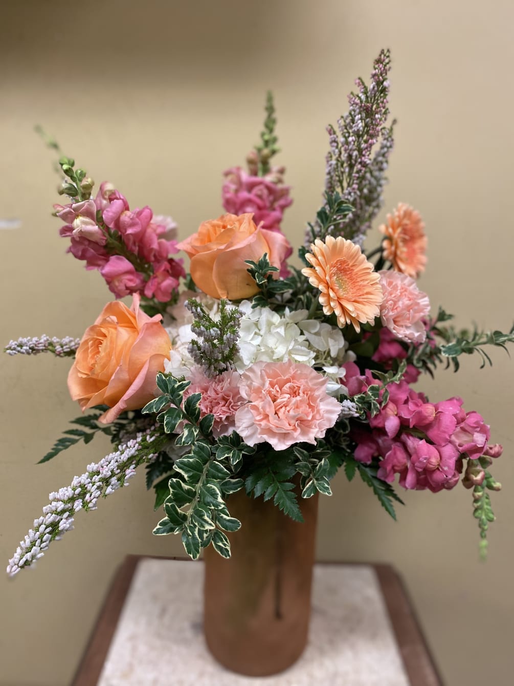 Beautiful mixture of pinks, whites, and peach tones, with seasonal florals 