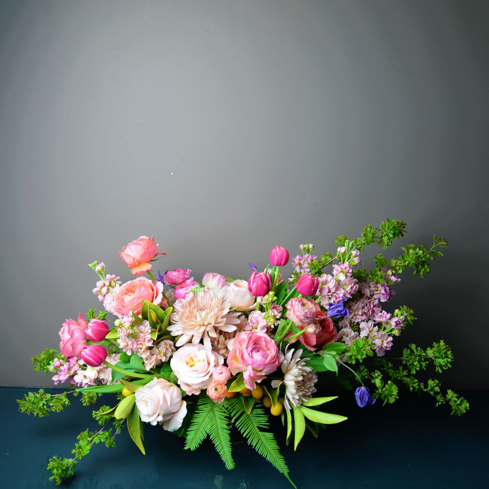 High end blooms highlight this luxurious selection of warmer tone blooms in