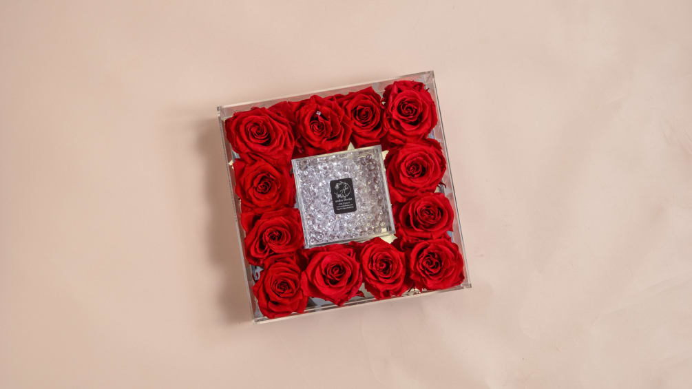 A dozen Everlasting Roses, in a beautiful mirror bottomed case. In the