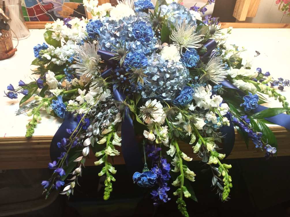 A variety of blue and white flowers for the top of the