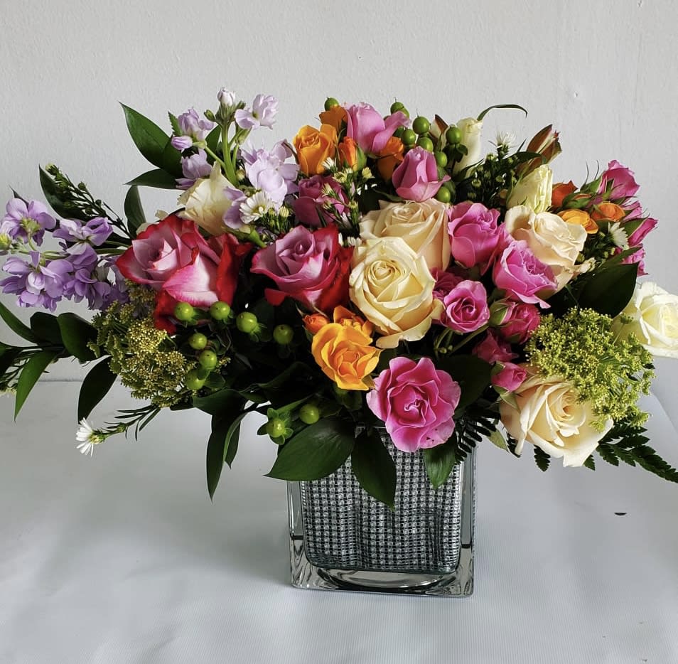 This beautiful arrangement put in a silver vase with a mixer of