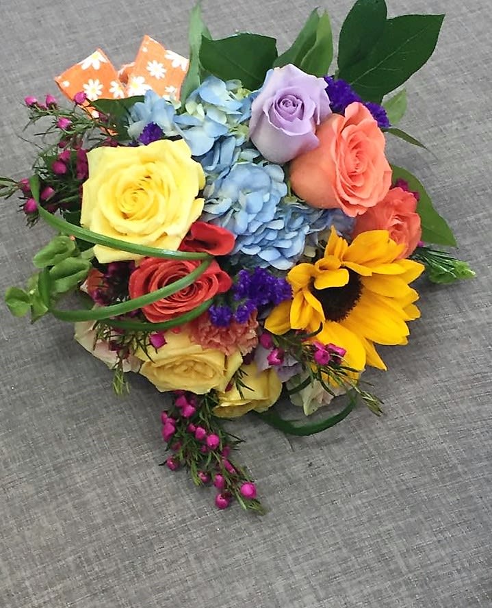 ROUND &amp; BRIGHT WITH ASSORTED MIXED SEASONAL FLOWERS.