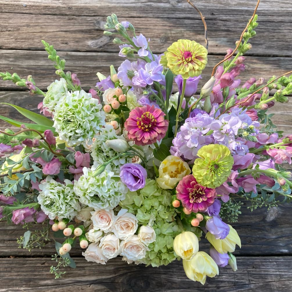 Hydrangea, snapdragons, ranunculus, stock,(zinnias, when in season), and lisianthus in a colorful