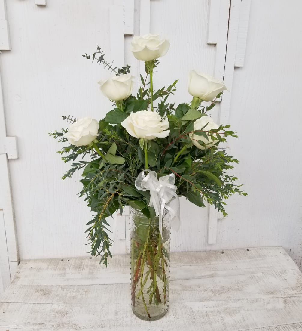 Half dozen white roses