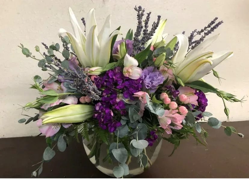 Nice mixture of Lilies, Stock, Eucalyptus, Hypericum, Berries, and Roses in a