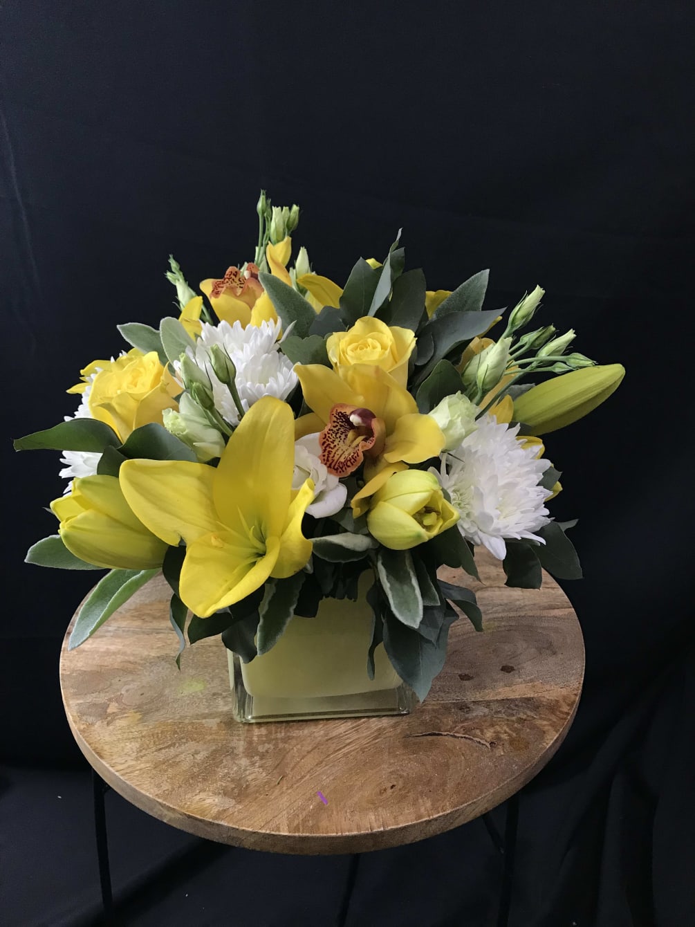 These yellow lilies are warm and inviting. Interspersed with greenery and bursts