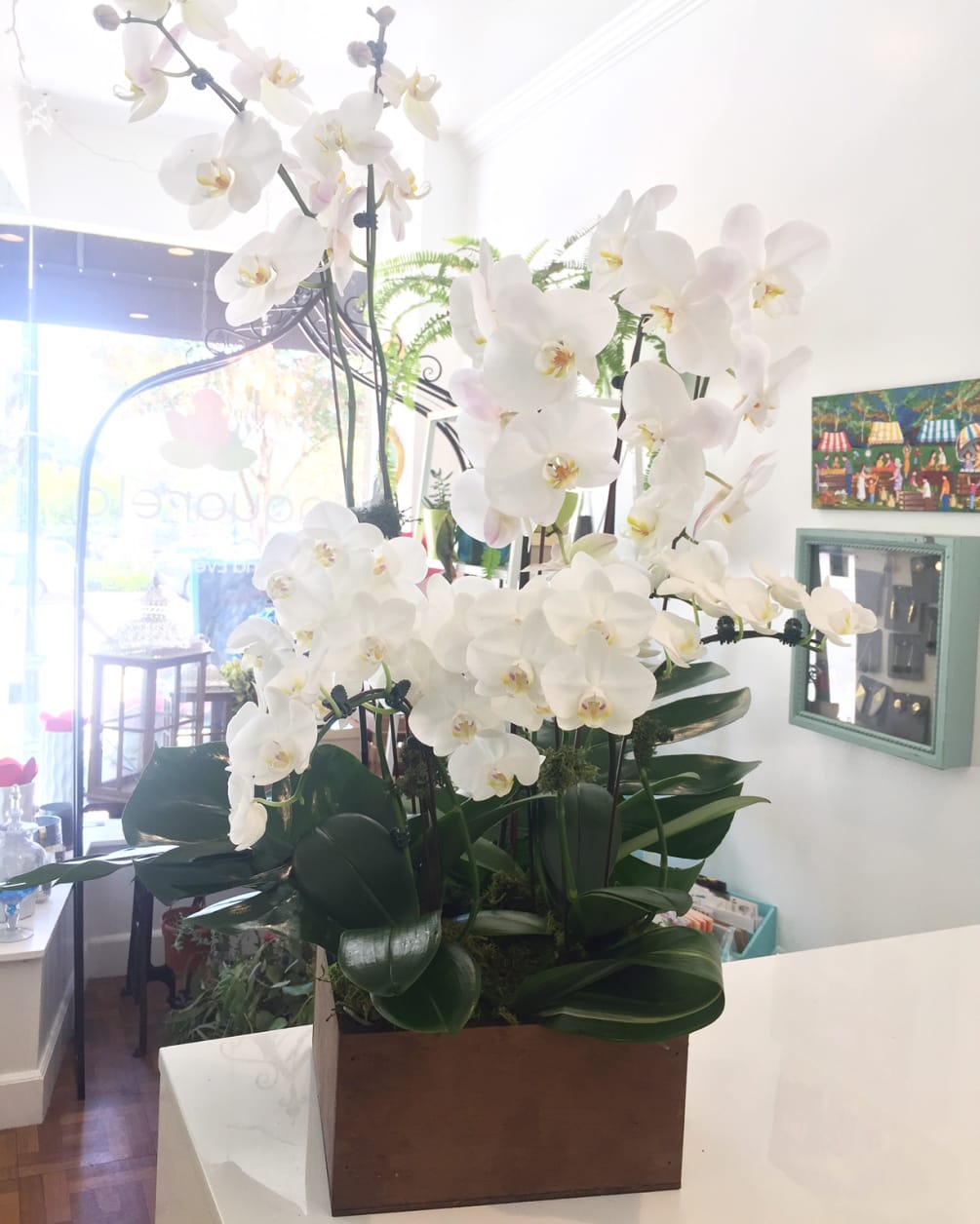 Elegant and meaningful mix of white orchids, different sizes in a recycled