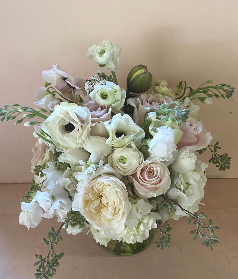 The white and wonderful stems in this beautiful arrangement create a floral