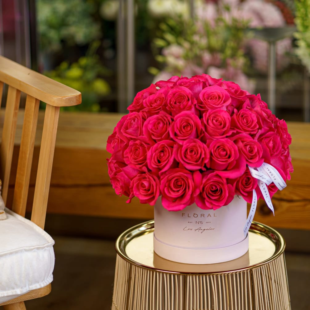 A bright arrangement with Pink Floyd Roses in FLORAL N5 Signature Box.