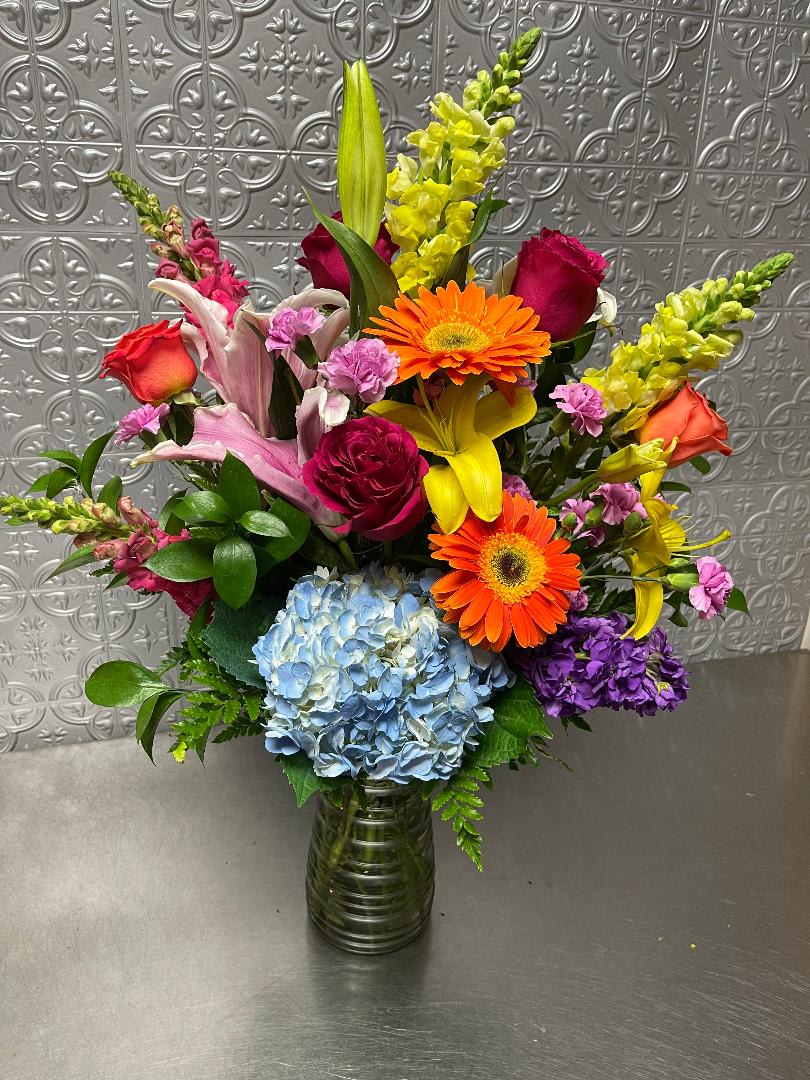 Beautiful spring colorful arrangement with an assortment of fresh flowers perfect for