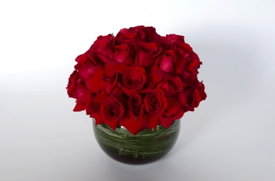 A beautiful composite of short stem roses with a touch of dramatic