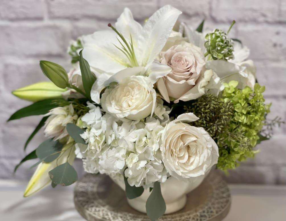 White and Pearls hues in a white ceramic vase. 