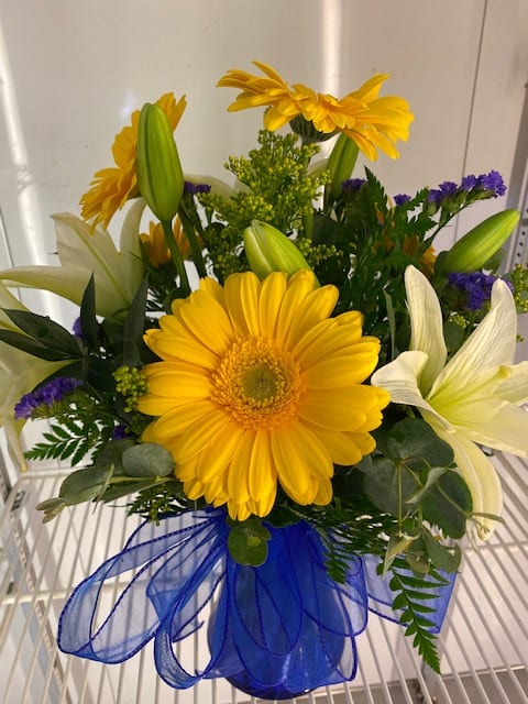 Yellow gerberas and lilies will speak to anyone and lift their spirits