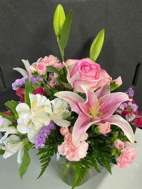 Make their day with this arrangement of pink roses, lilies and alstroemerias