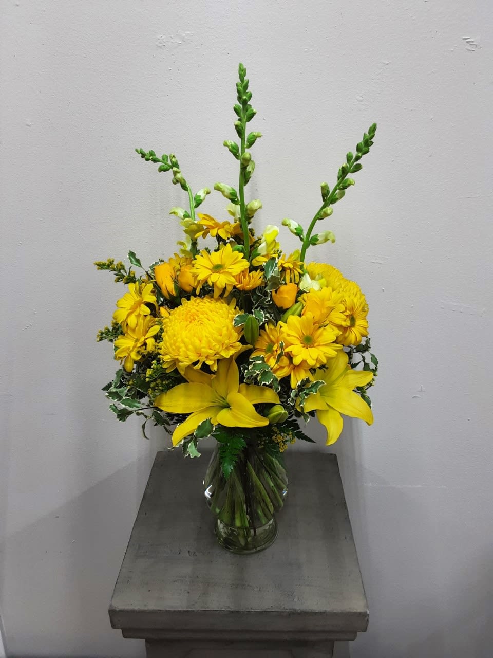Assortment of yellow flowers will brighten any occasion and any room. 
Sure