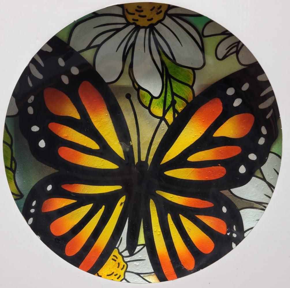 A monarch butterfly creates a classic bird bath design that birds and