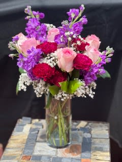 A floral arrangement filled with seasonal mixed flowers 