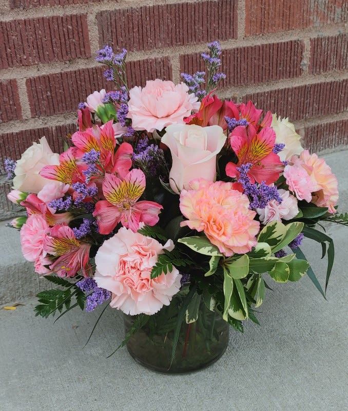 Designed by the owner of the shop, this soft arrangement  features