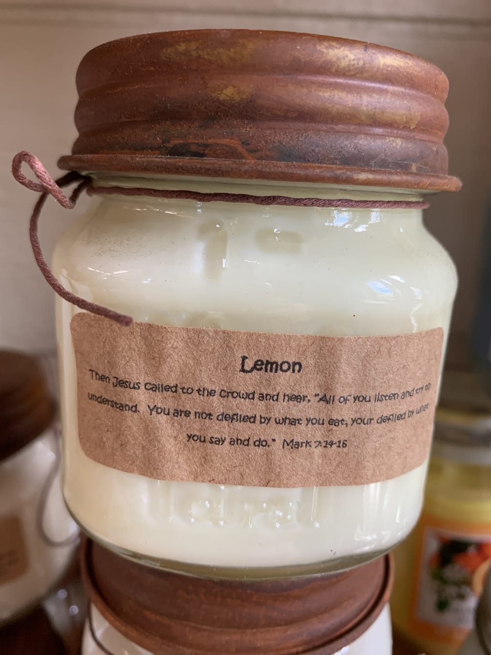 Lemon scented mason jar candle with biblical message.
Made by Frontier Rose Candles