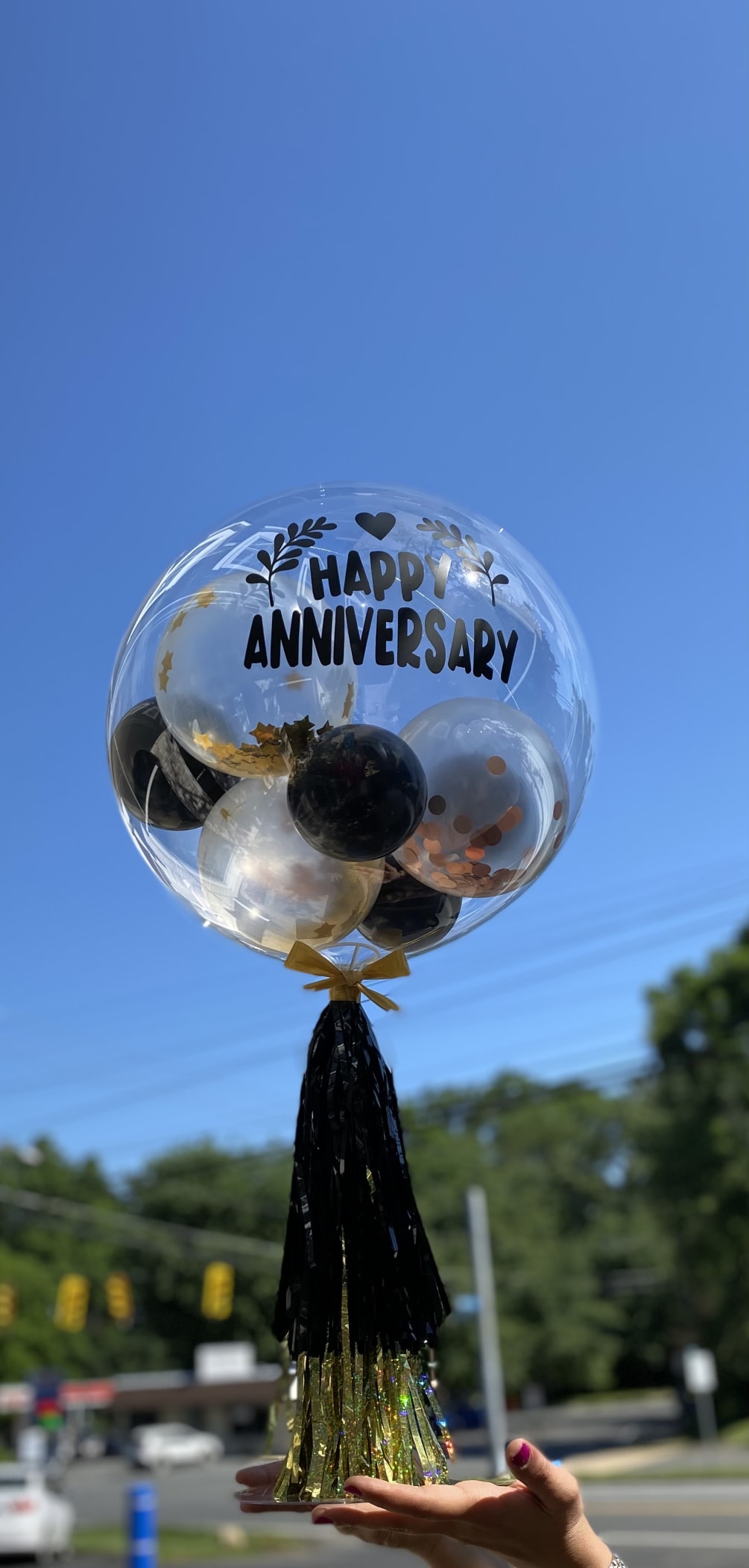 Celebrate an amazing milestone with this unique balloon arrangement! A one of