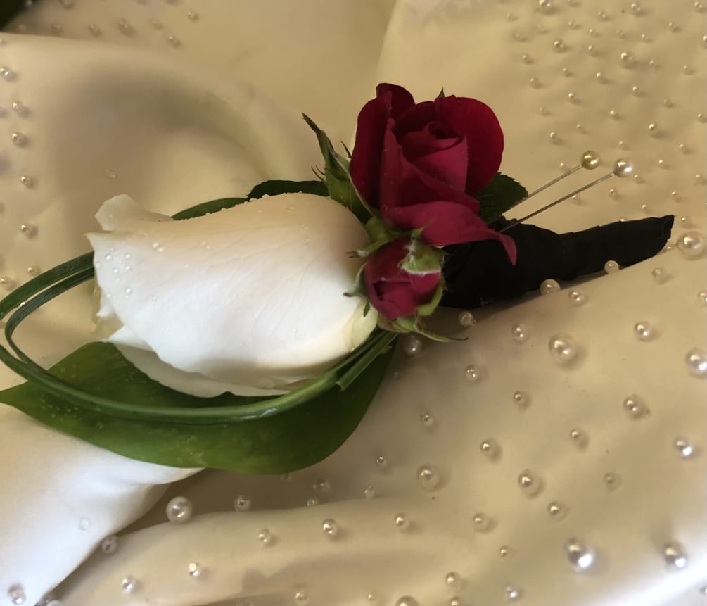 White Rose Boutonniere Dash of red Spray roses Black ribbon