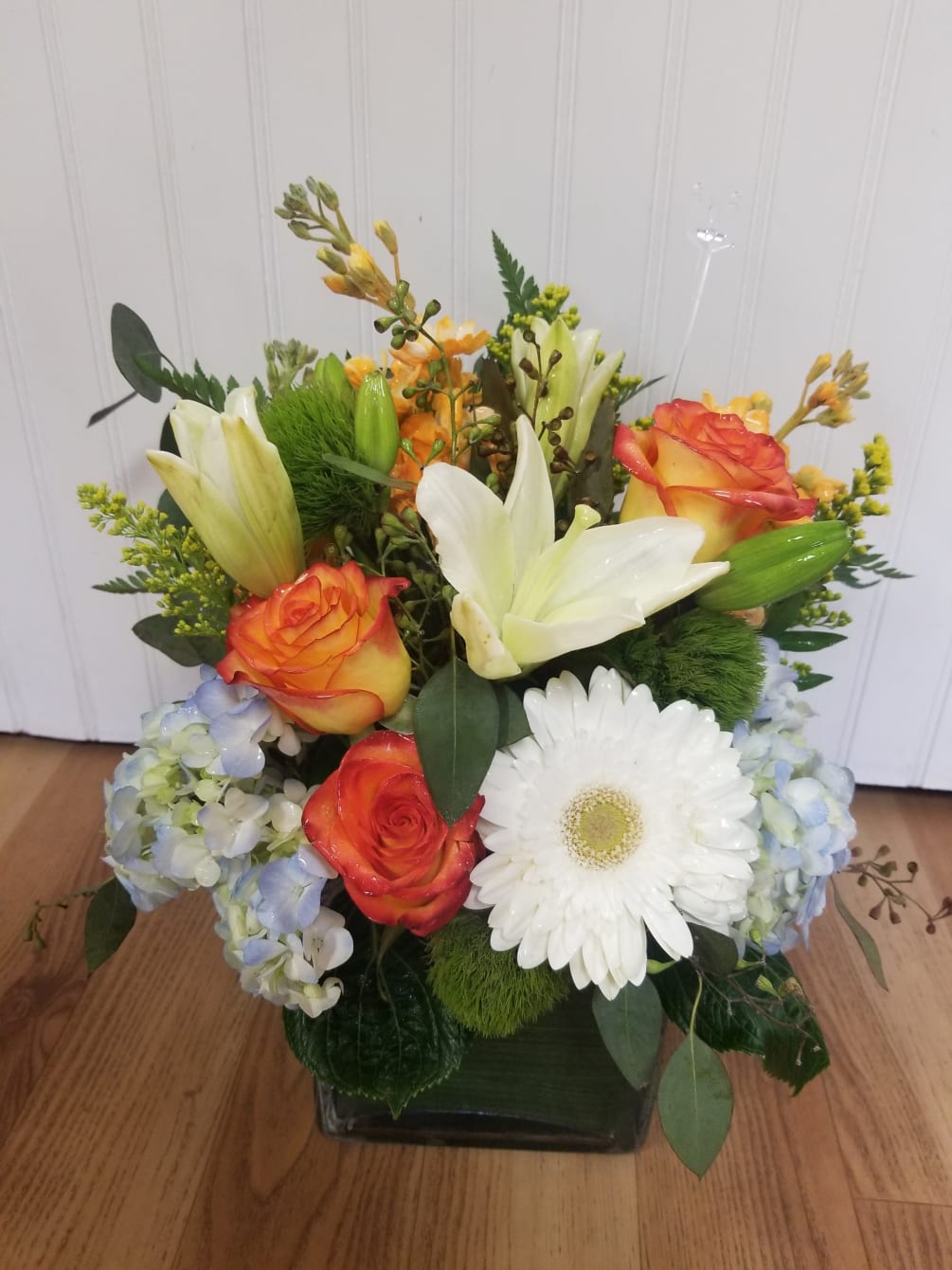This lively summertime arrangement is great for all occasions. It contains lillies