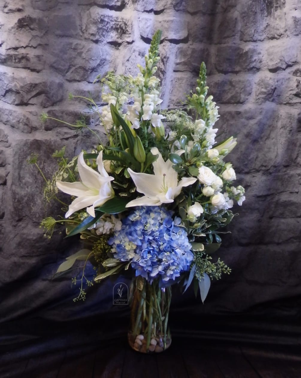 Blues and White for any occasion. Hydrangeas, Spray Roses, Snap Dragons and