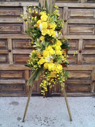 Small yellow funeral spray