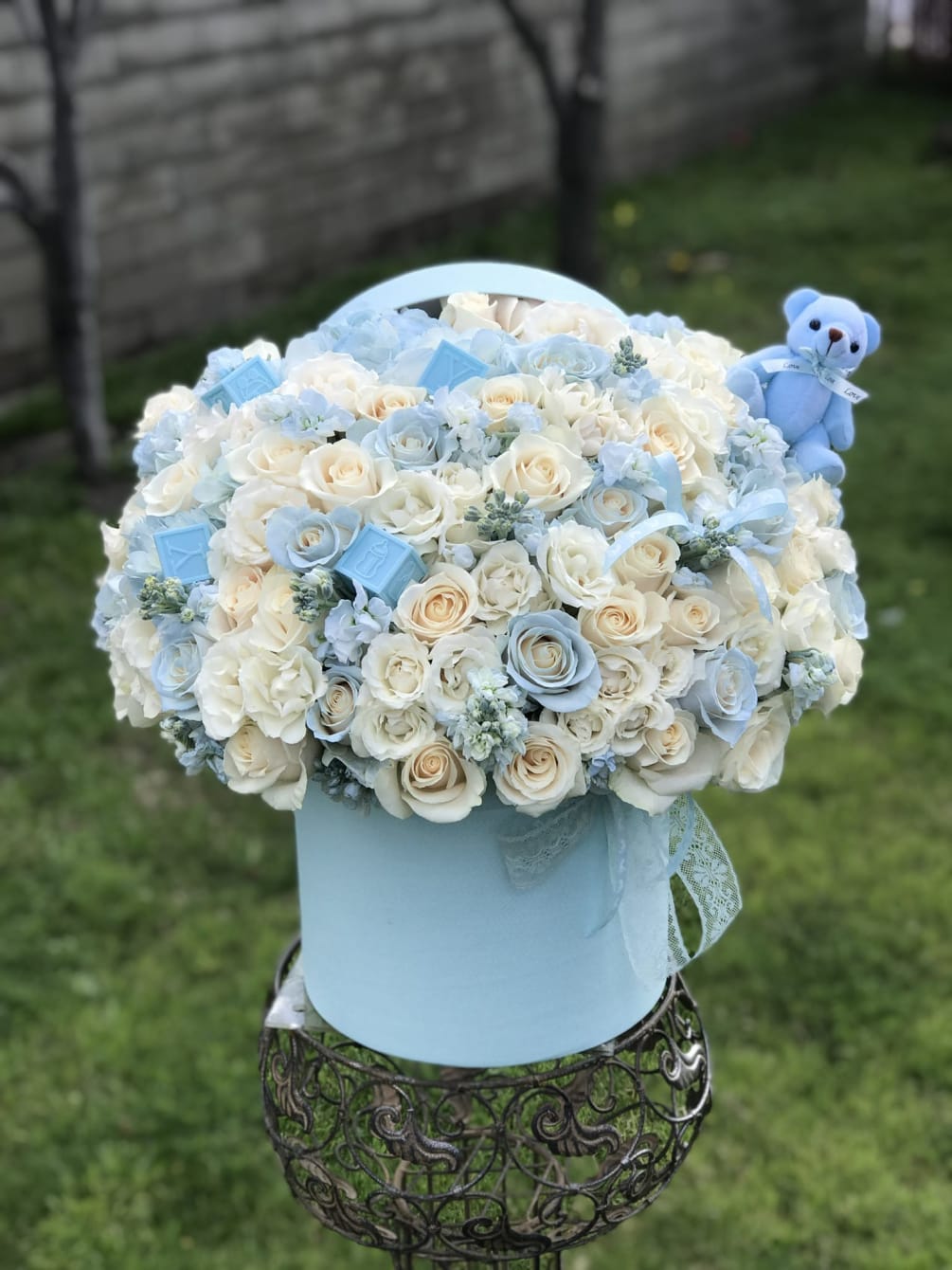 Welcome baby boy arrangement. Full of roses, spray roses, hydrangeas and stock.