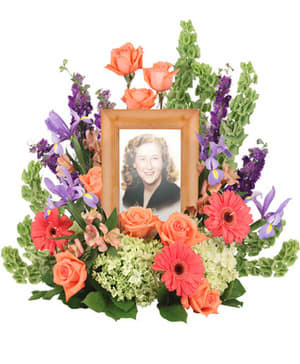 Sympathy arrangement designed to display and urn or picture at a service
(Urn