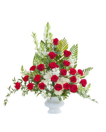 Red and white premium varieties of flowers combine with lush foliage in