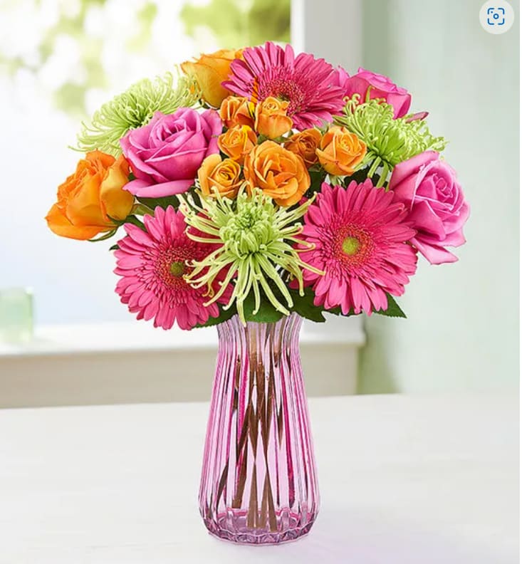colorful mix of available flowers. comes in a colored or clear vase