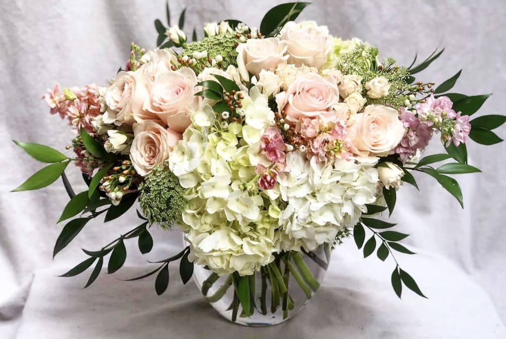 DELUXE VERSION SHOWN*
Designed with blush roses, blush spray roses, misty green, peach
