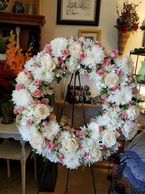 White Cremones, White cushion Chrysanthemums, Wax flower, Pink Spray roses, and Sweet