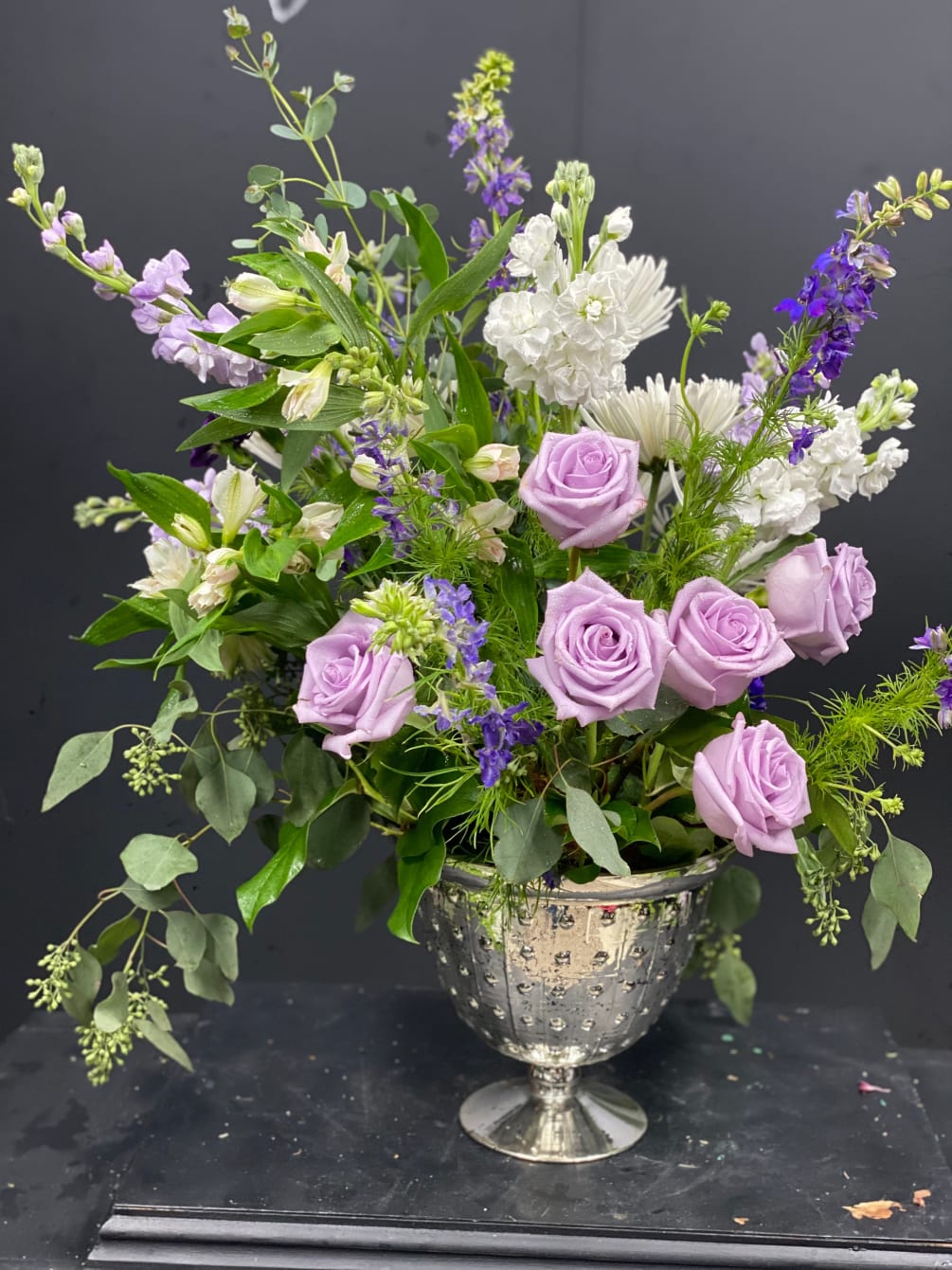 This beautiful arrangement is made in a mercury glass vase and contains