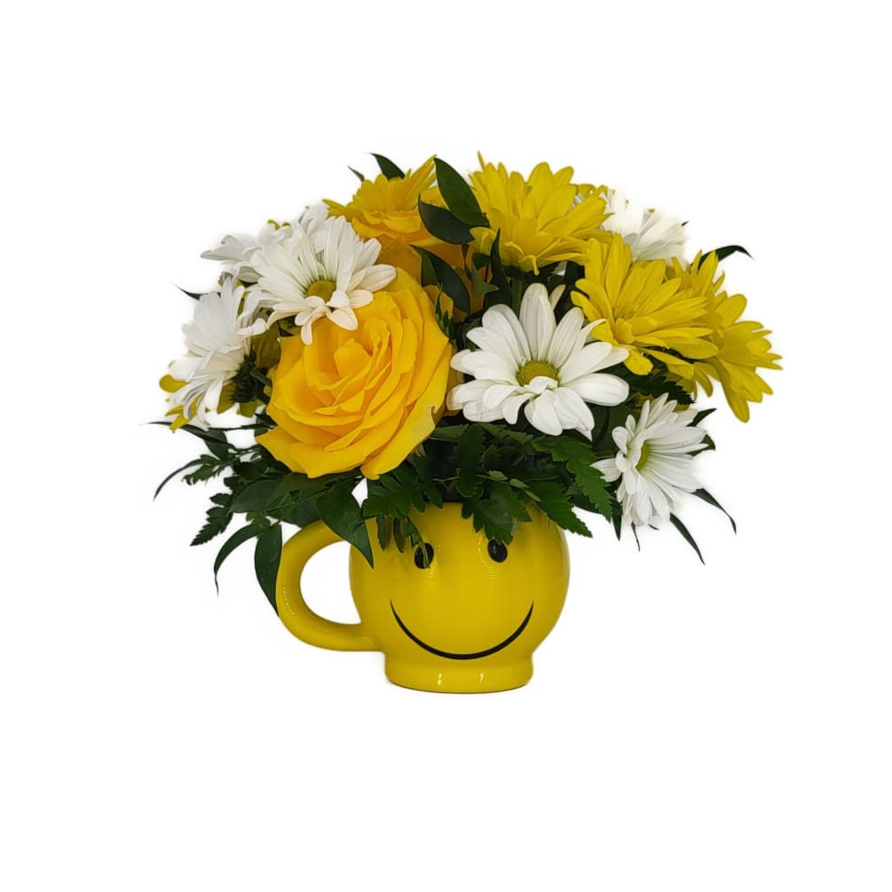 Full of happy flowers, this ceramic happy face mug will bring smiles