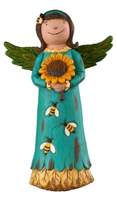 The busy bee perched on top of this garden angel sets her