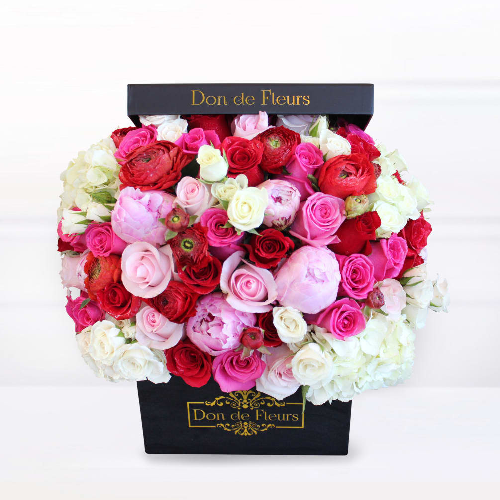 Our classic box arrangement features beautifully unique roses that are each handpicked