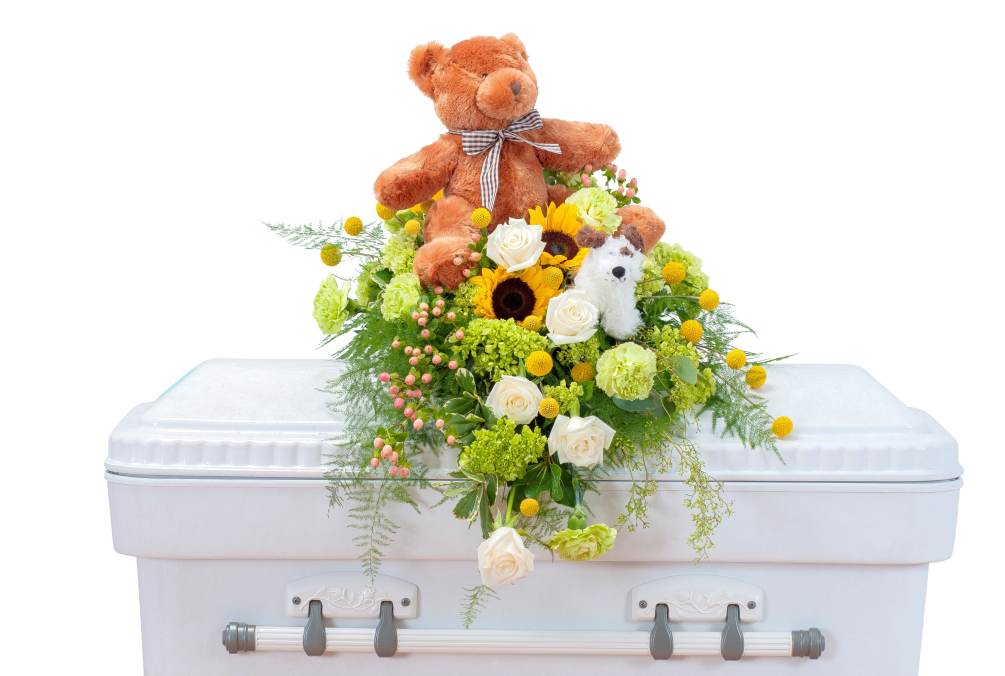 This sweet combination of flowers and plush is perfect for a tiny