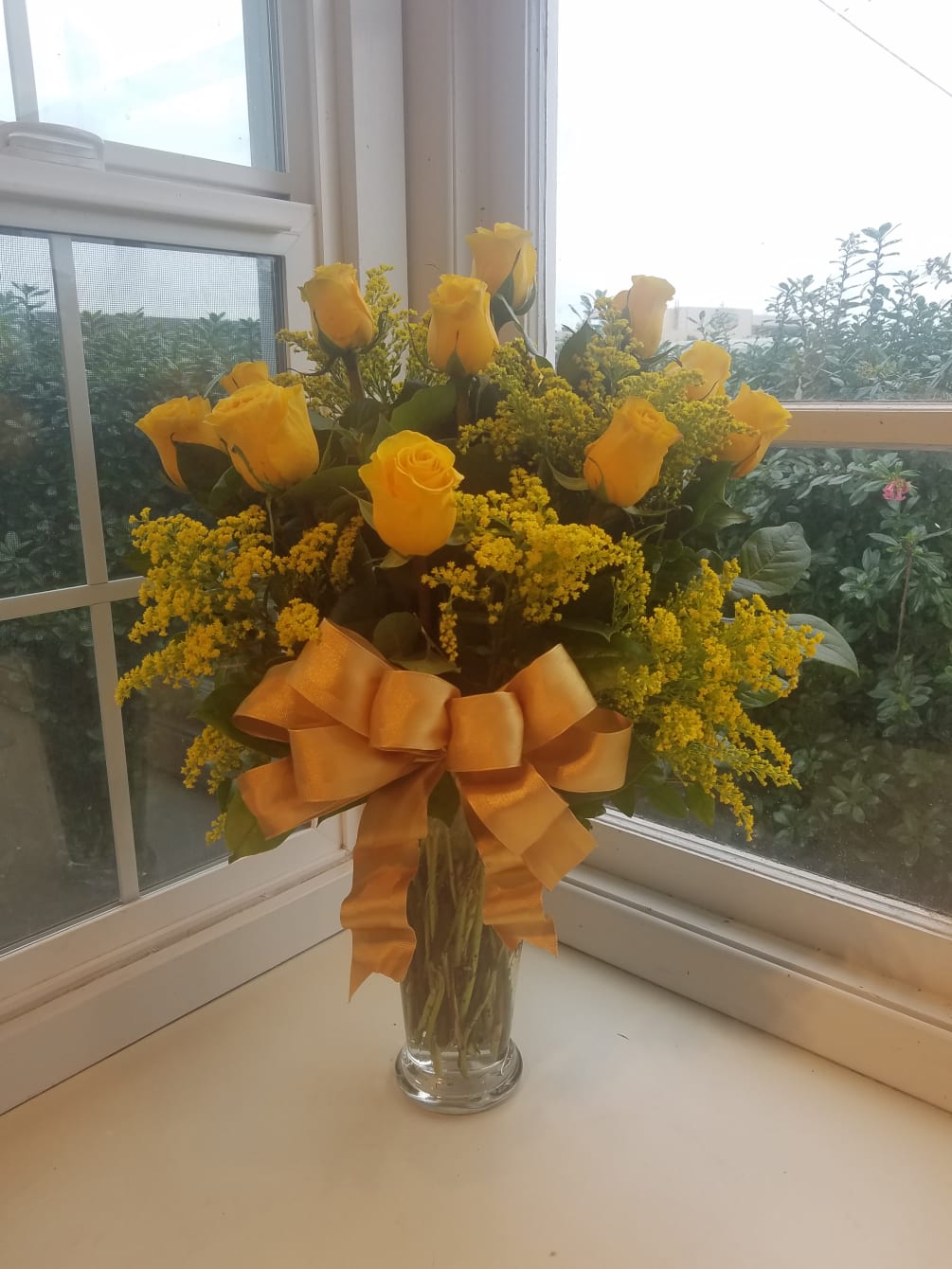 One dozen yellow roses will bring a smile and touch of sunshine