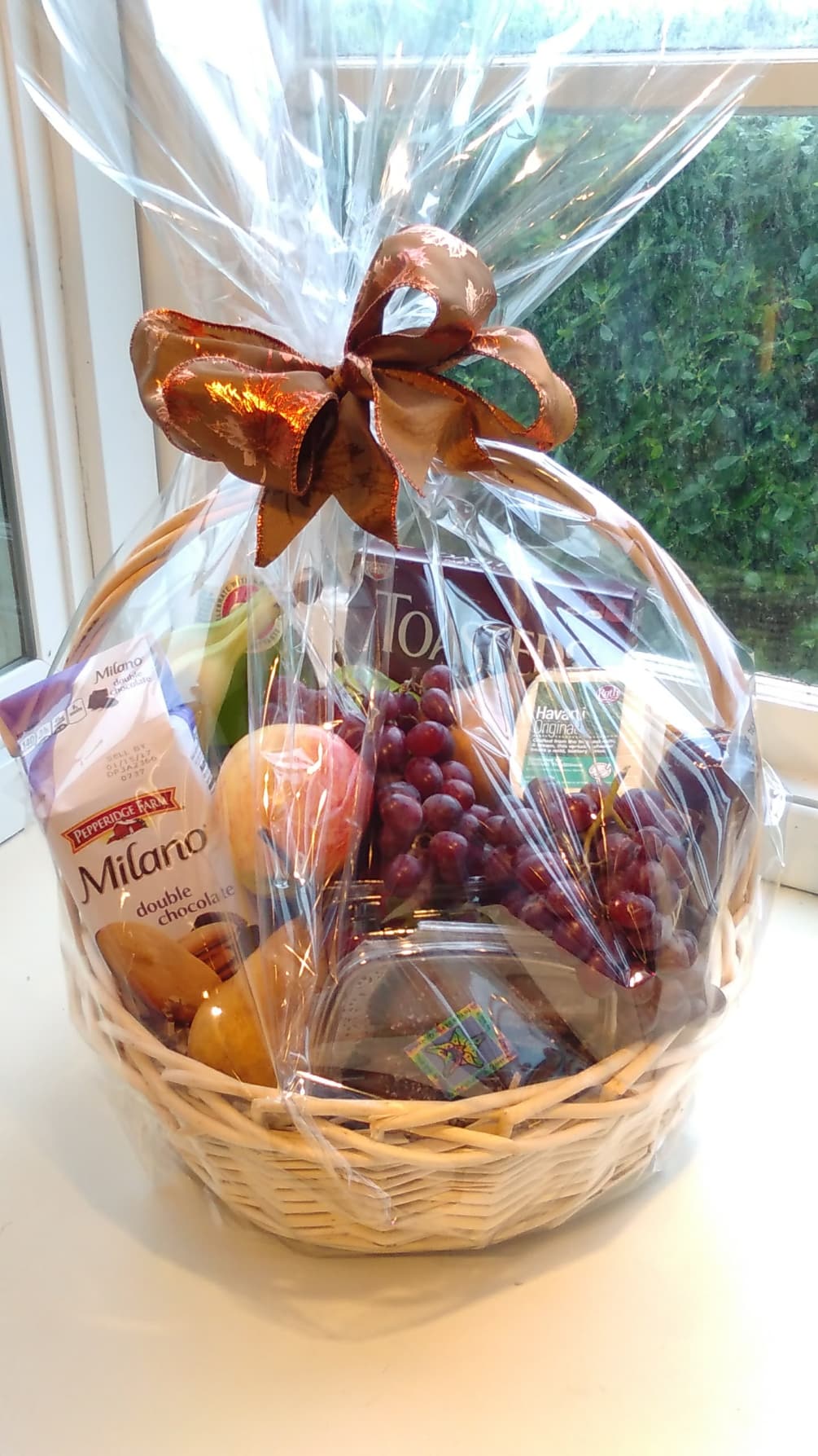 This lovely basket is filled with delectable goodies that are sure to