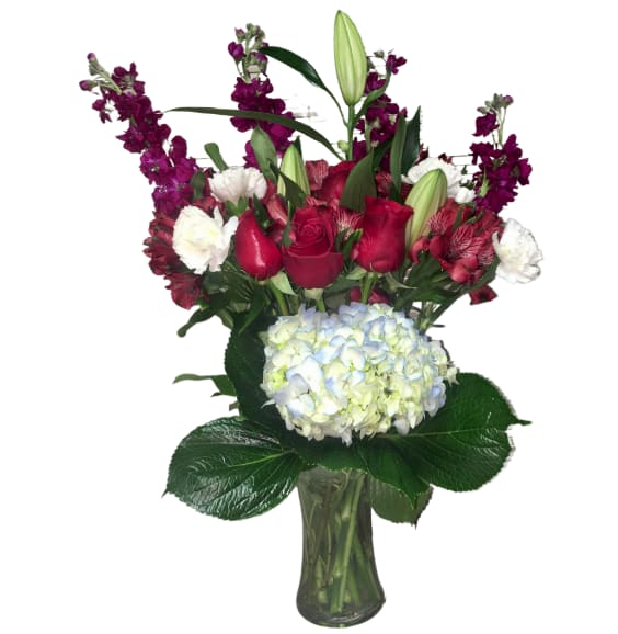 Big arrangement with Purple Stock, Red Alstroemerias, Red Roses, Hot pink and