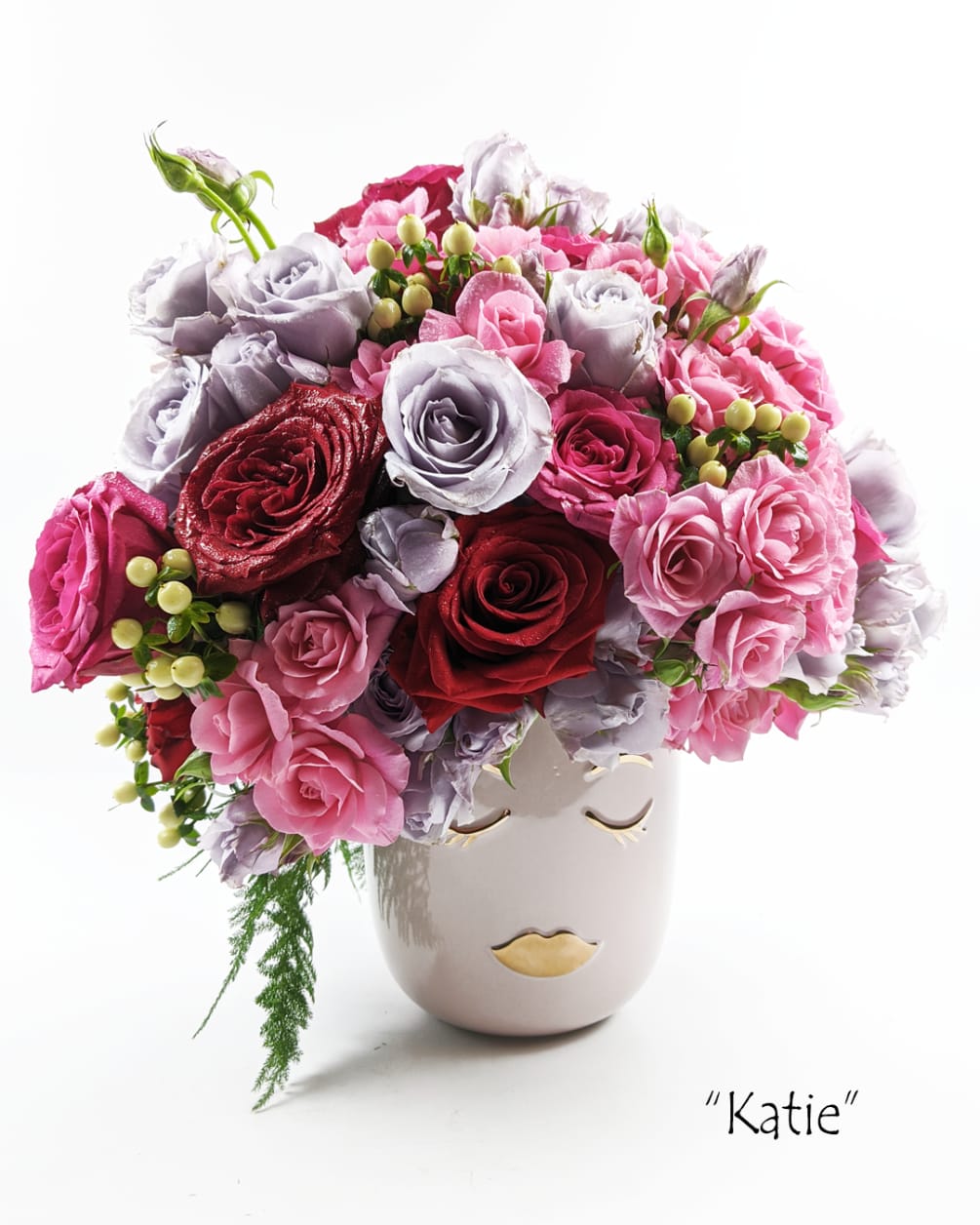 Personally crafted, fresh, seasonal bouquet tastefully arranged in a 10 inch tall