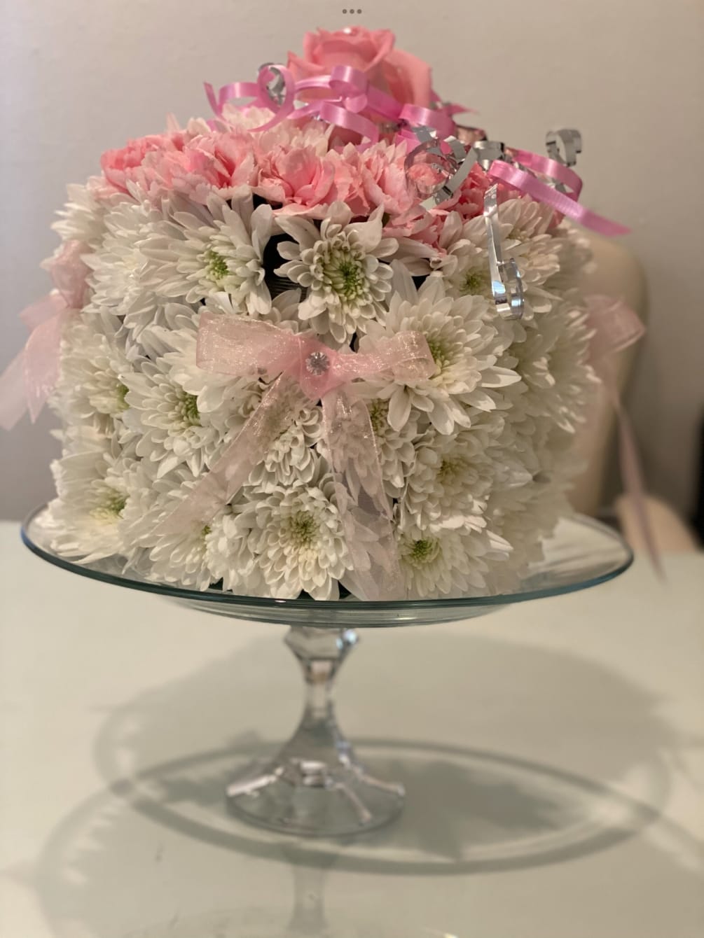 Flower cake on a beautiful glass cake stand