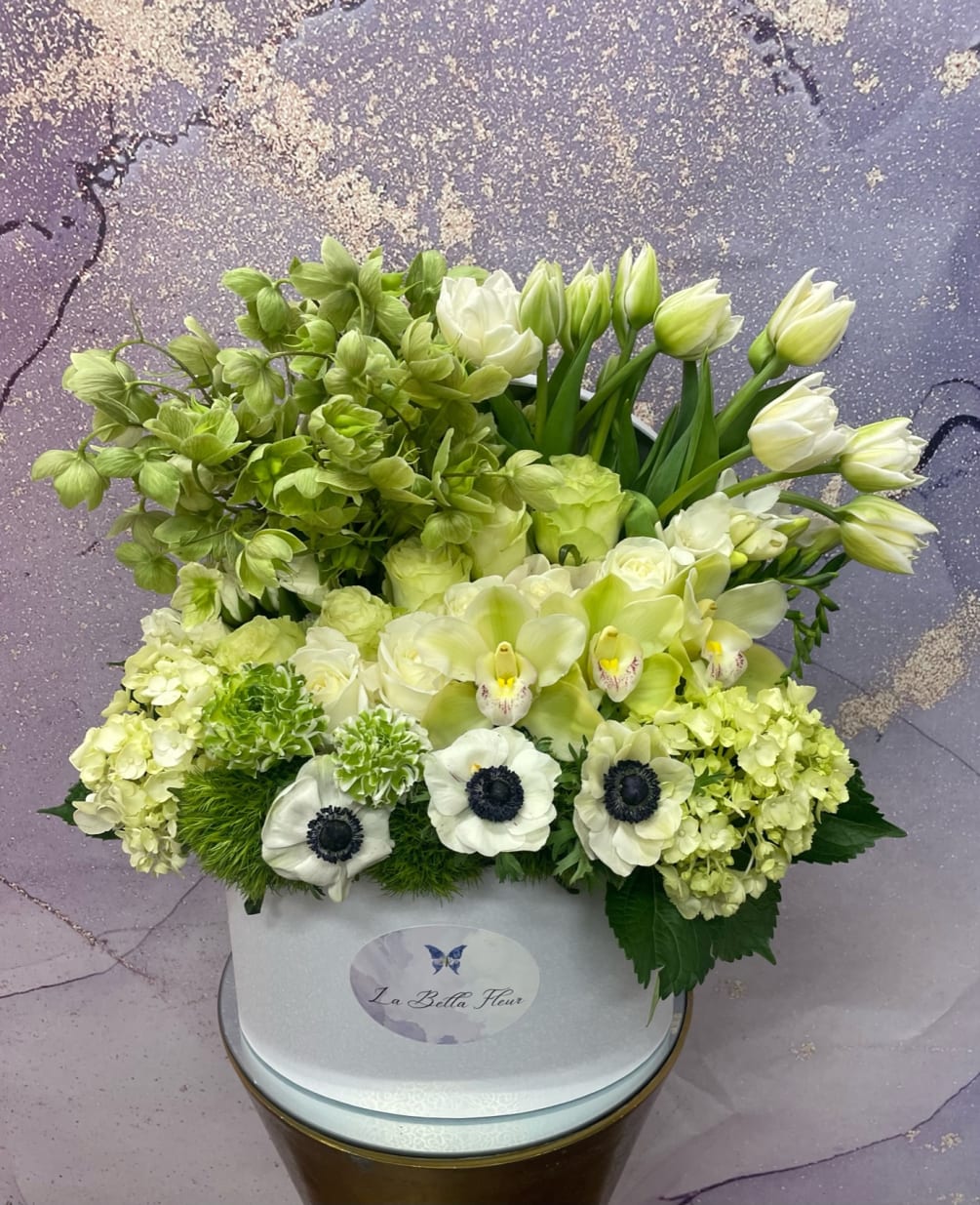 Box filled with sweet green and white flowers. Perfect for anyone loving