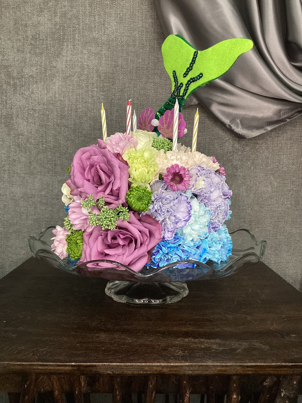 A Collection of Stunning Florals in The Shape of a Themed Cake