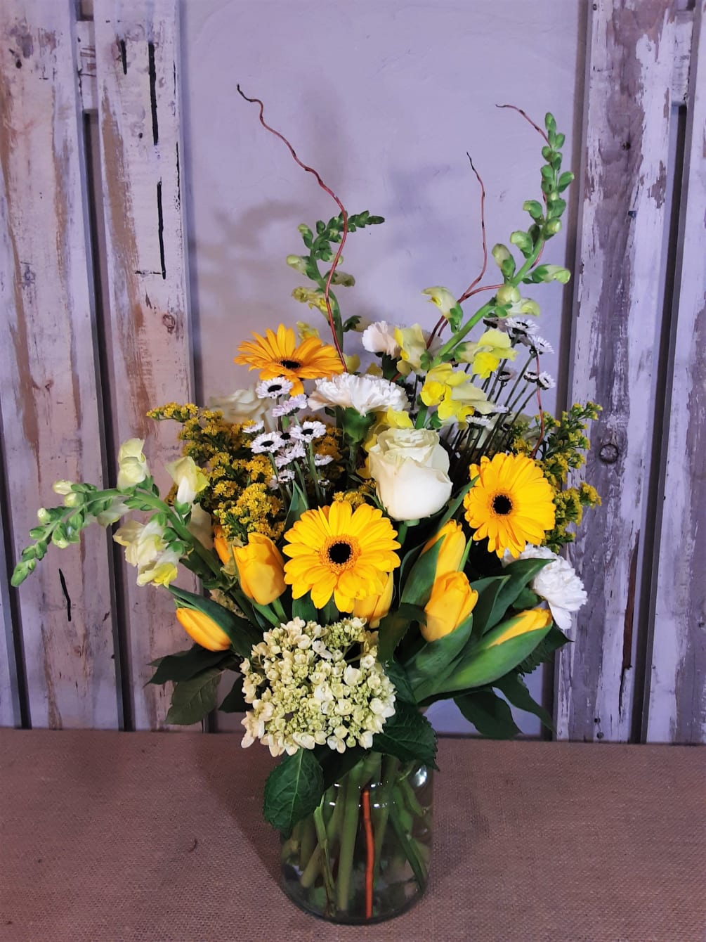 Brighten any day with this lovely arrangement is sunny shades of yellow