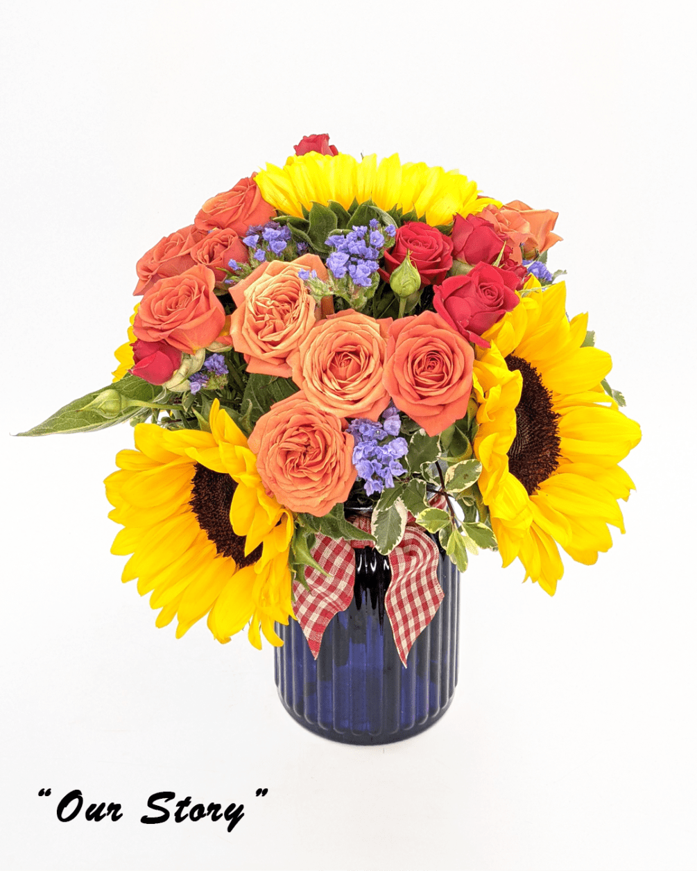 Hand-crafted mixed flower bouquet in a blue vase. Each purchased arrangement may